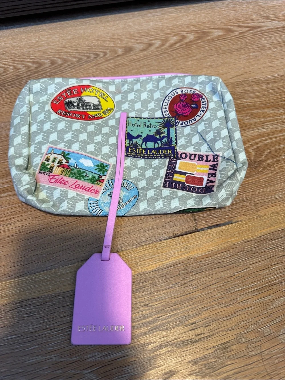 Estee Lauder Gray Cosmetic Pouch with Travel Patch Design
